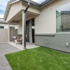 a backyard with grass and a patio