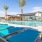 sun beds next to a swimming pool